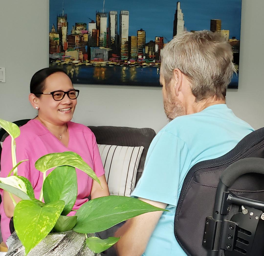 Nurse providing personalized home care to elderly client